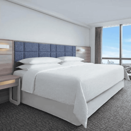 Polyester bed skirts for hotels, Airbnb, and resorts, perfect for bulk bedding supply