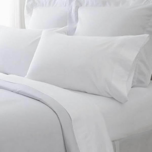 Premium cotton-polyester blend pillowcases for hotels, Airbnb, and motels, ideal for comfort and bulk bedding supply