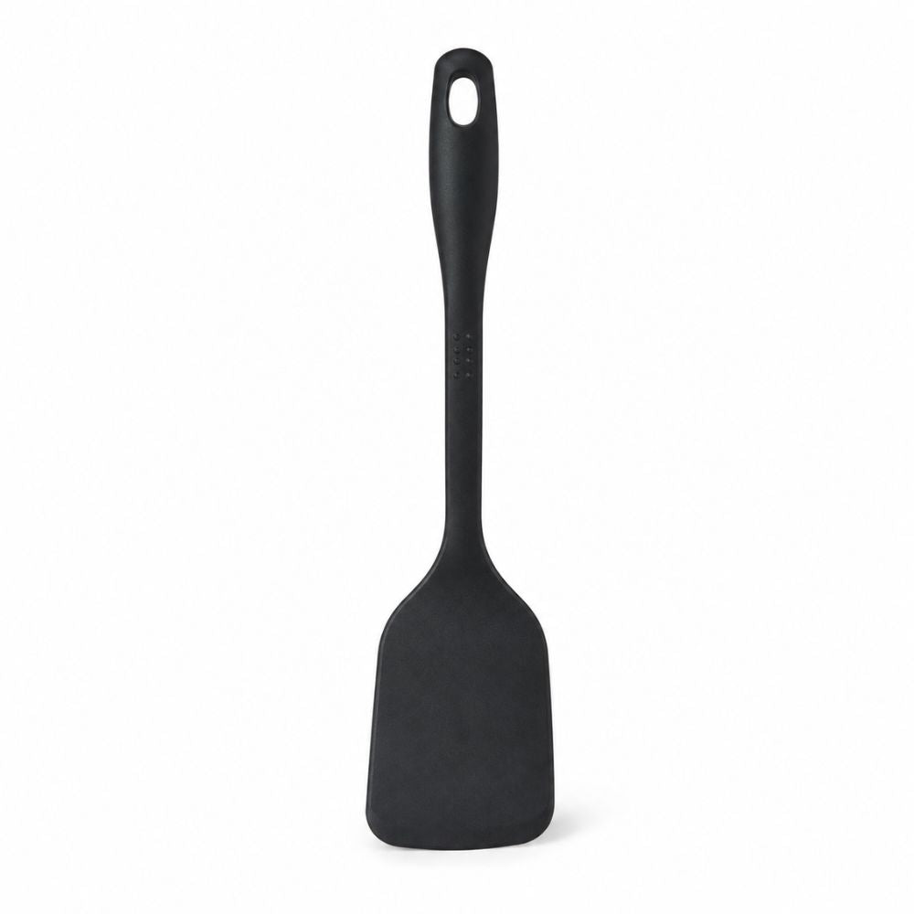 Black T-fal solid turner spatula for hotel suites, rental properties, furnished accommodations and hospitality kitchen setups.