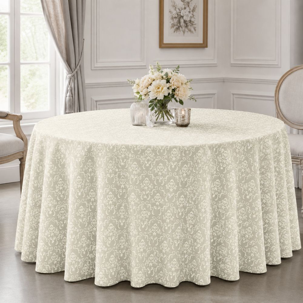 Ivory patterned round tablecloth for hotels, banquet halls, restaurants and event venues, styled on a formal round dining table.