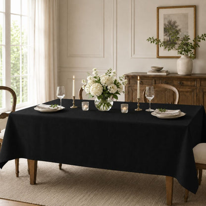 Black rectangular tablecloth for hotels, restaurants, catering and banquet venues, shown in an elegant formal table setting.