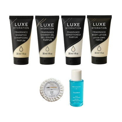 Six-piece Luxe Hydration hotel amenity set with four 30 ml toiletries, 13 g guest soap and FreshMint mouthwash for guest rooms.