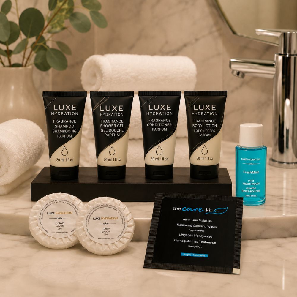 Luxe Hydration hospitality amenity collection with toiletries, two soap sizes, mouthwash and makeup wipe for hotels, resorts and Airbnbs.