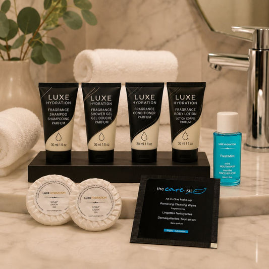 Luxe Hydration hospitality amenity collection with toiletries, two soap sizes, mouthwash and makeup wipe for hotels, resorts and Airbnbs.