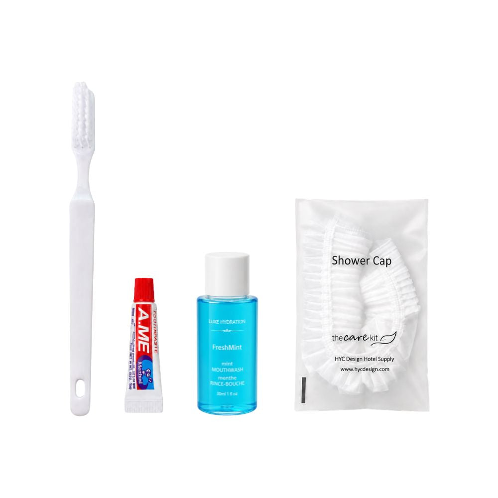 Hotel guest dental and hygiene kit with toothbrush, toothpaste, FreshMint mouthwash and individually packaged shower cap for hospitality use.