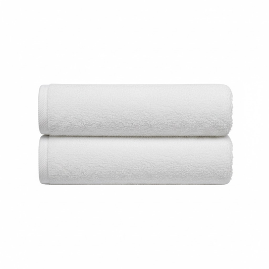 Oversized cotton bath sheets designed for hotel use, offering consistent softness, durability, and full guest coverage