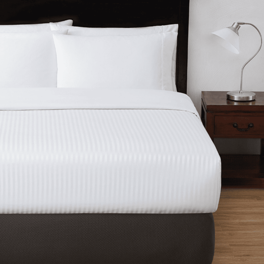 Striped decorative top sheet for hotels, Airbnb, and resort bedding—ideal for elevated room presentation and guest comfort