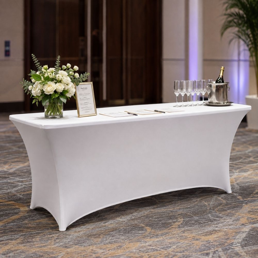 White fitted spandex rectangular table cover styled for a professional hospitality event, ideal for registration, catering, conferences and trade shows.