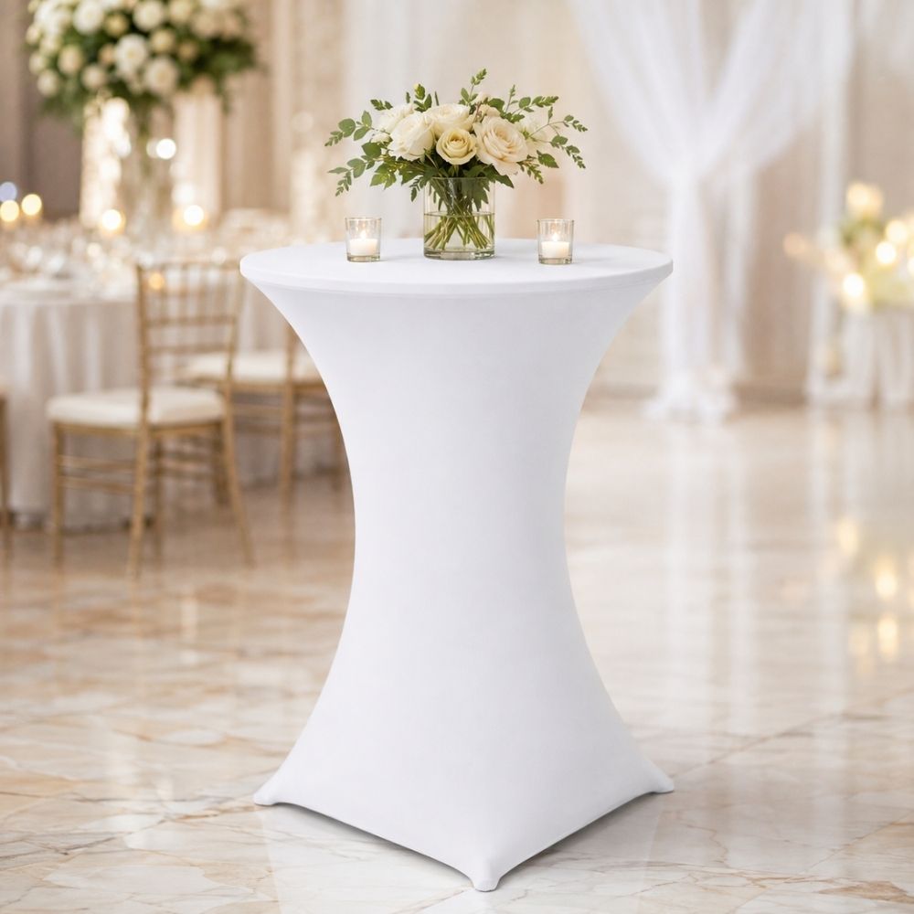 White fitted spandex cocktail table cover displayed in an elegant reception setting, suitable for hotels, weddings, banquet halls and event venues.
