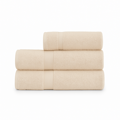 Affordable essential 3-piece beige towel set made from 100% combed cotton, soft and durable, perfect for hotels, spas, Airbnbs, or everyday home use