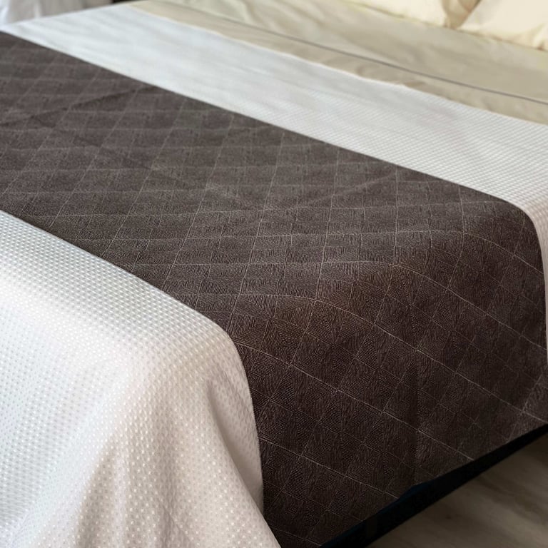 Custom-made bed scarf with modern ridges, adding a touch of luxury to bedroom decor