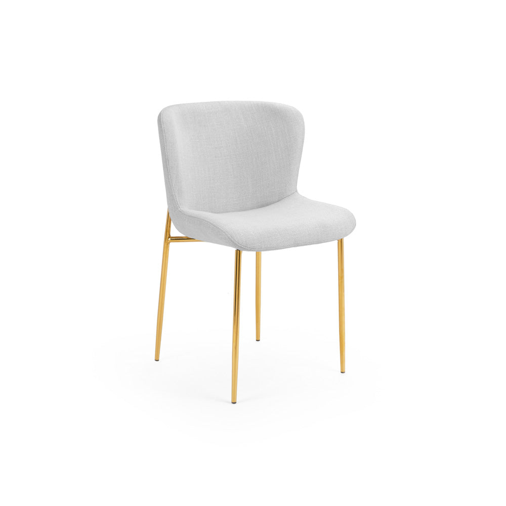 Modern accent chair with white upholstered seat and gold metal legs, perfect for hotel rooms, dining areas, or stylish contemporary interiors.