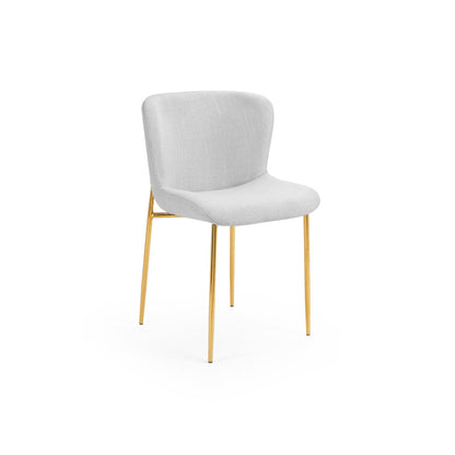 Modern accent chair with white upholstered seat and gold metal legs, perfect for hotel rooms, dining areas, or stylish contemporary interiors.