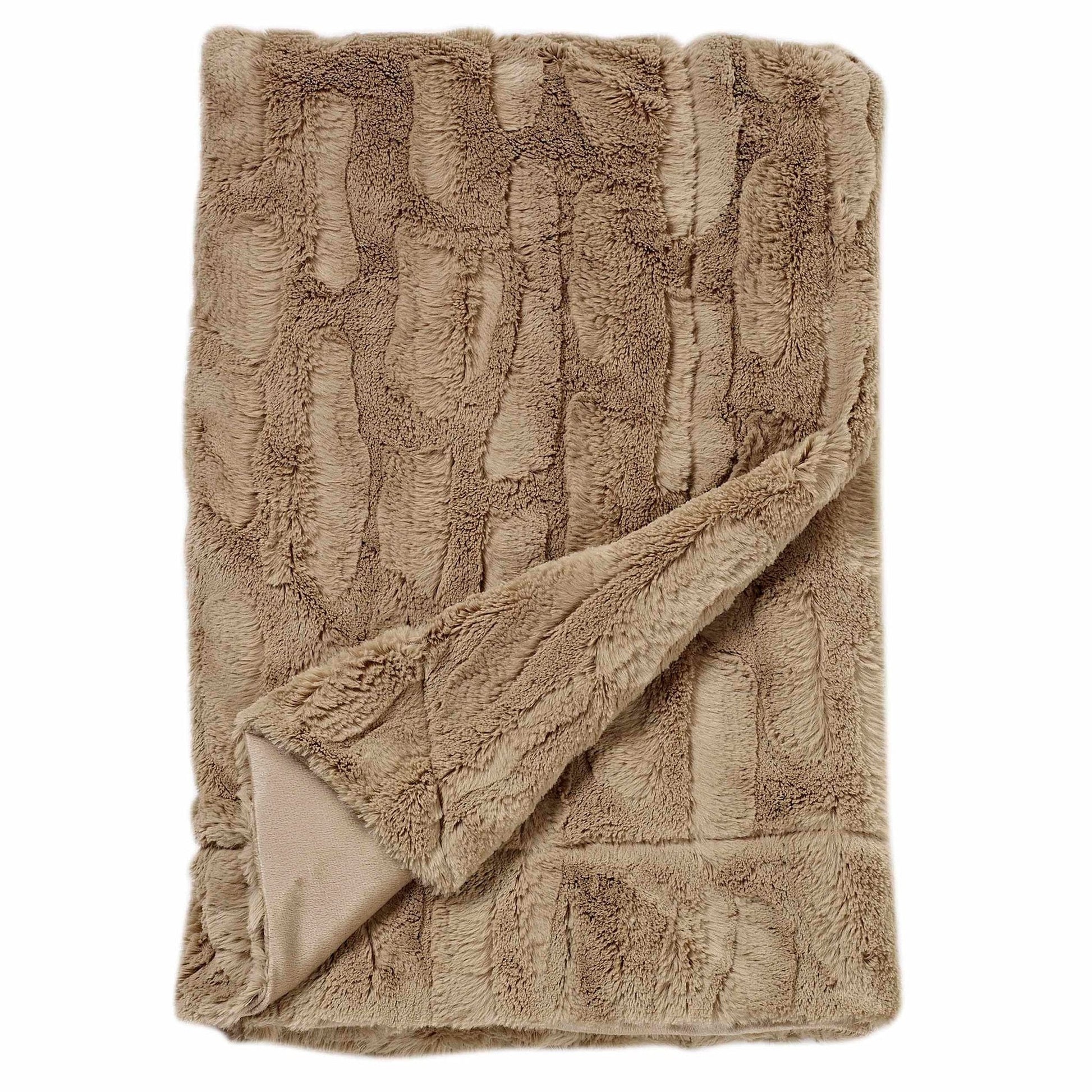 Soft faux fur throw for luxury inns and resorts, lightweight and elegant for bed or sofa staging in guest accommodations