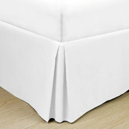 Soft microfiber bed skirt in solid color, designed for hotels and Airbnb guest beds to conceal bases and elevate room aesthetics