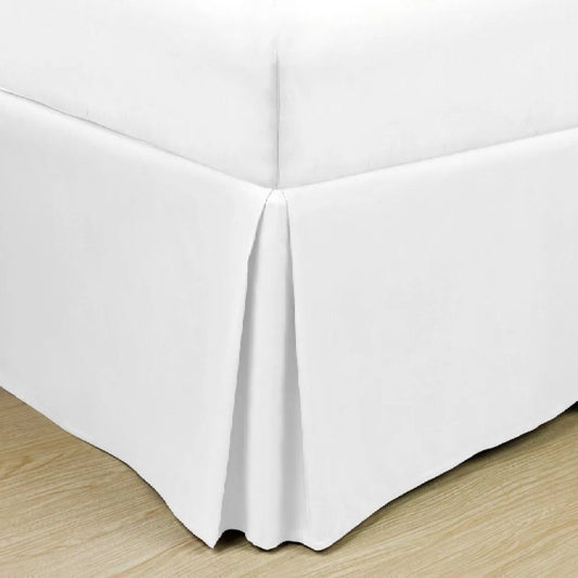 Soft microfiber bed skirt in solid color, designed for hotels and Airbnb guest beds to conceal bases and elevate room aesthetics